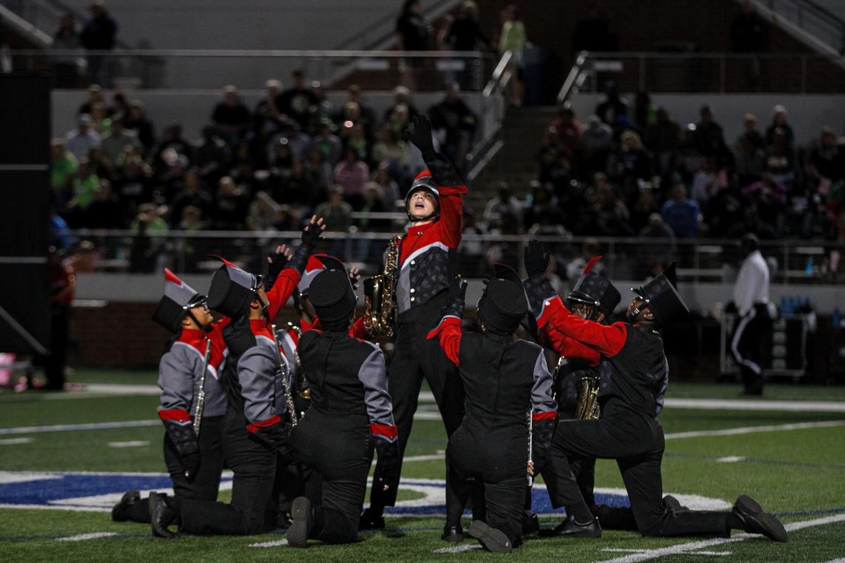 At half time Ryan Neef, 10, performs balled before band starts their performance. 