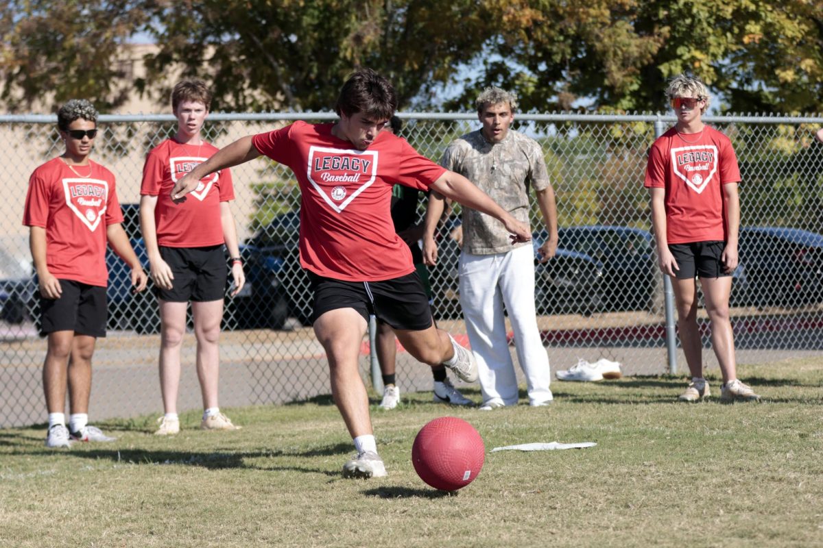 Micah Haynes, 12, kicks the ball at the Bronco Athletic Society kickball game. The Athletic Leadership Council hosted the game on Oct. 25. 
