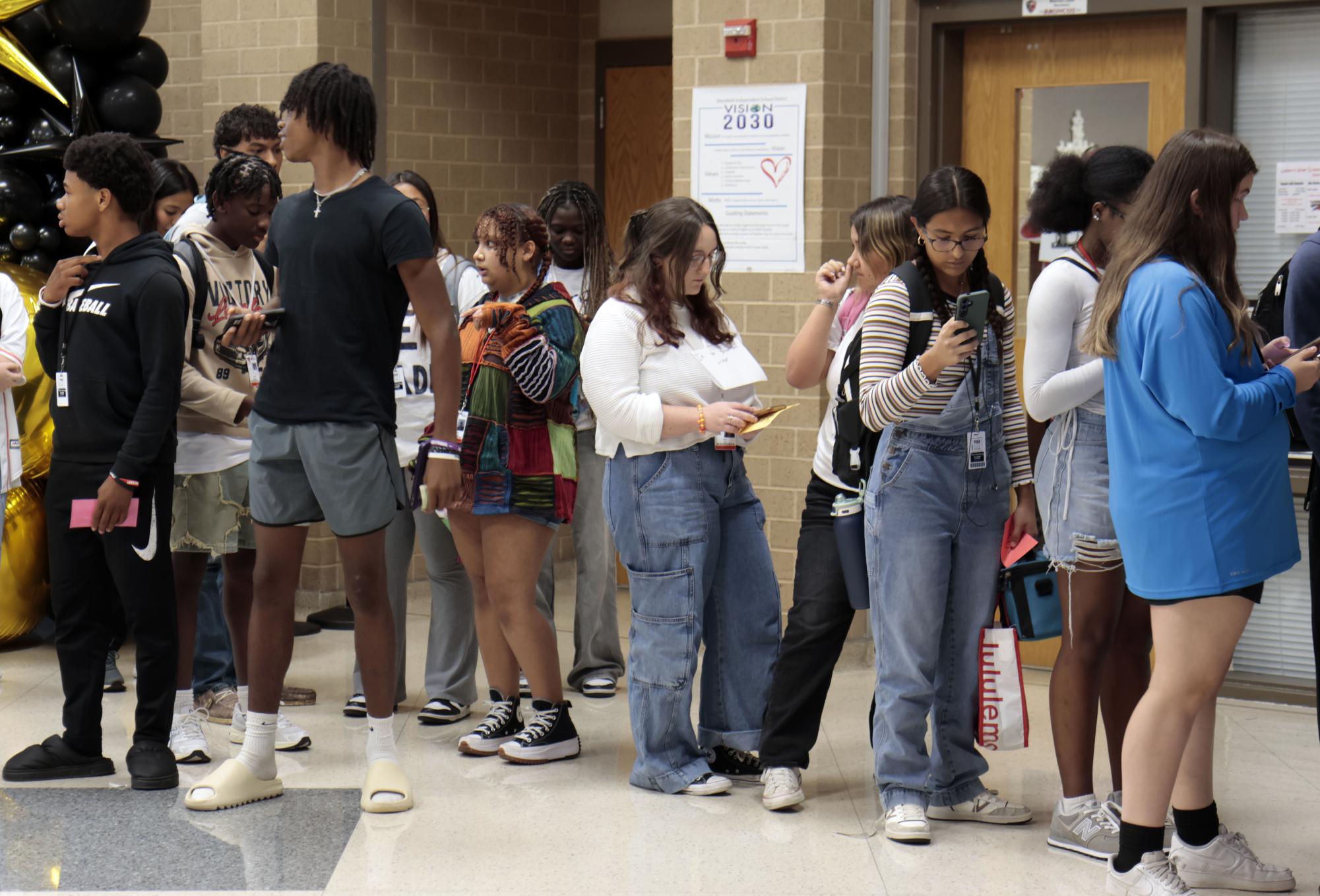 Students wait in line to buy the last 50 homecoming tickets during advisory on Oct. 2. Tickets sold out reaching maximum capacity of 800.