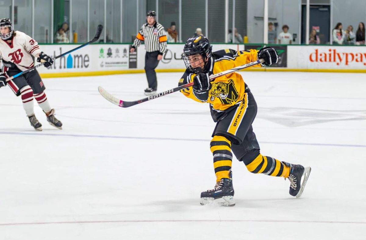 During their second home game, Maddox Puzzuole, 12, shots a slapshot in the offensive zone. The team won the game, extending their record to 2-1.