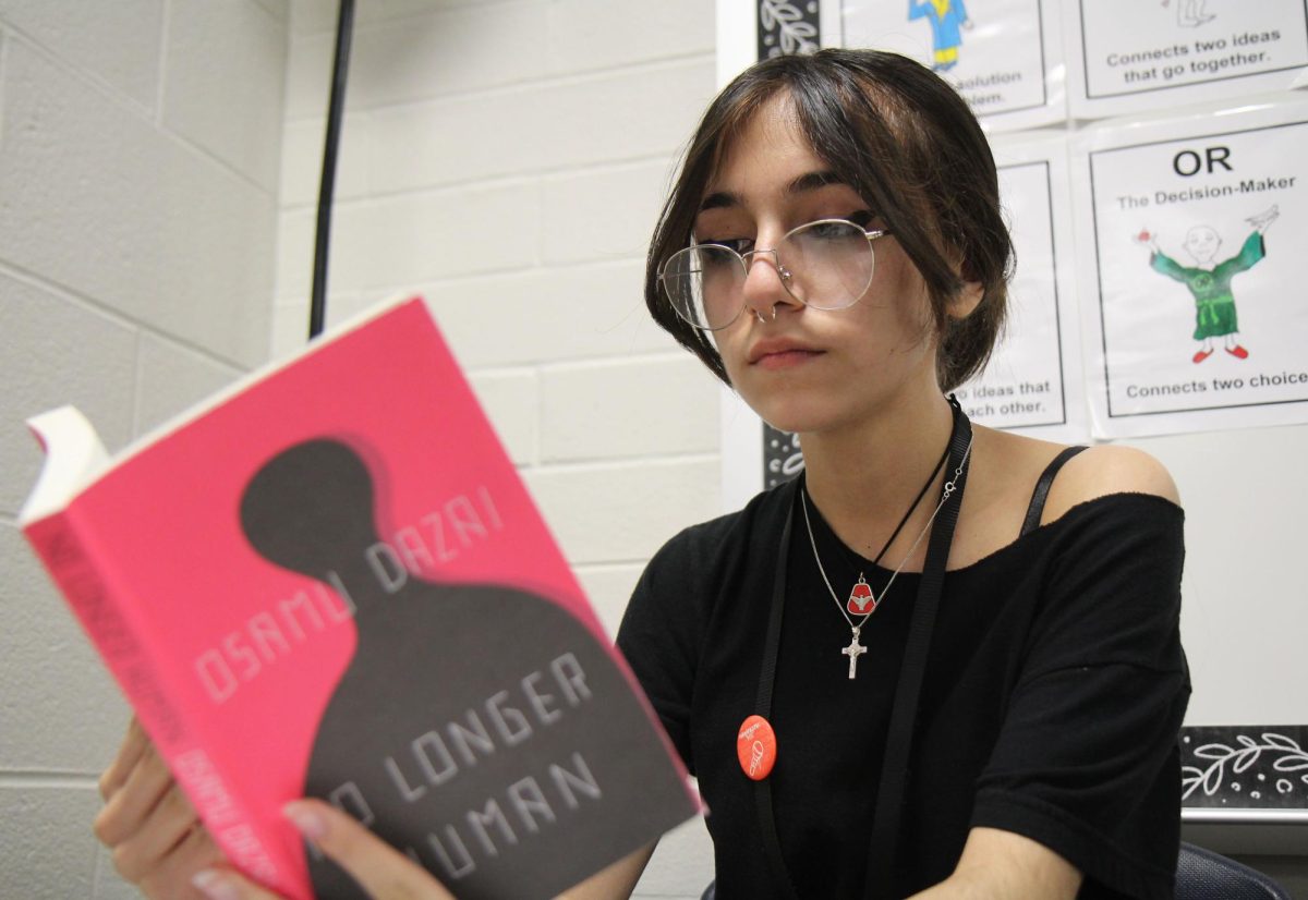 Mariana Lozano, 12, reads "No Longer Human" by Osamu Dazai as warm up for English. Students are required to keep a book or their choice in this class.