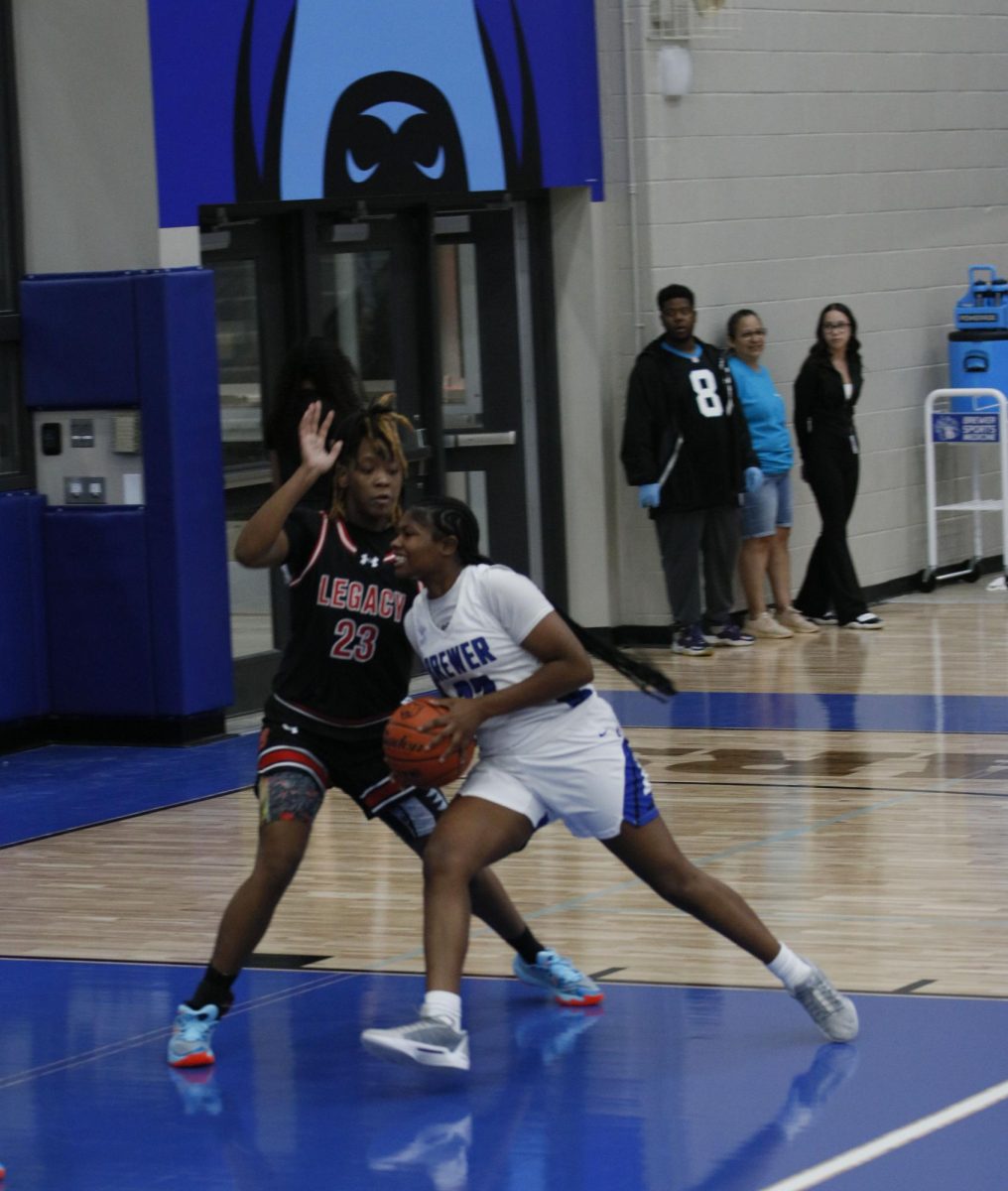 Leajah Maddox, 12, goes for the block while Brewers guard drive to the basket for a layup. But Maddox Fouls her leaving the score 30-23 Legacy up in the 2nd quarter.
