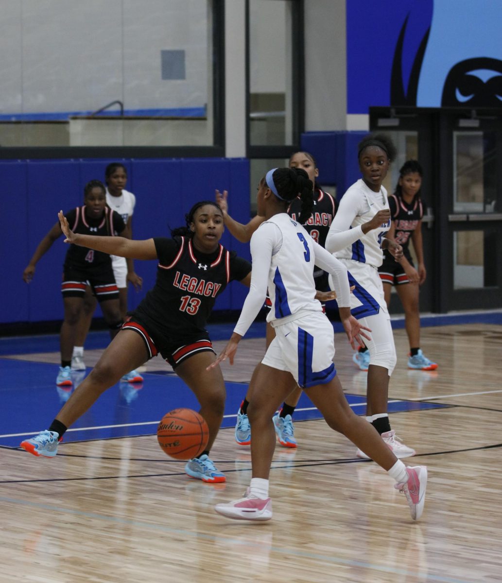 Tytiana Jones-Lockridge, 10, plays defence on Brewers guard in the first half of the game while Legacy is up by five points with the score 15-10.

