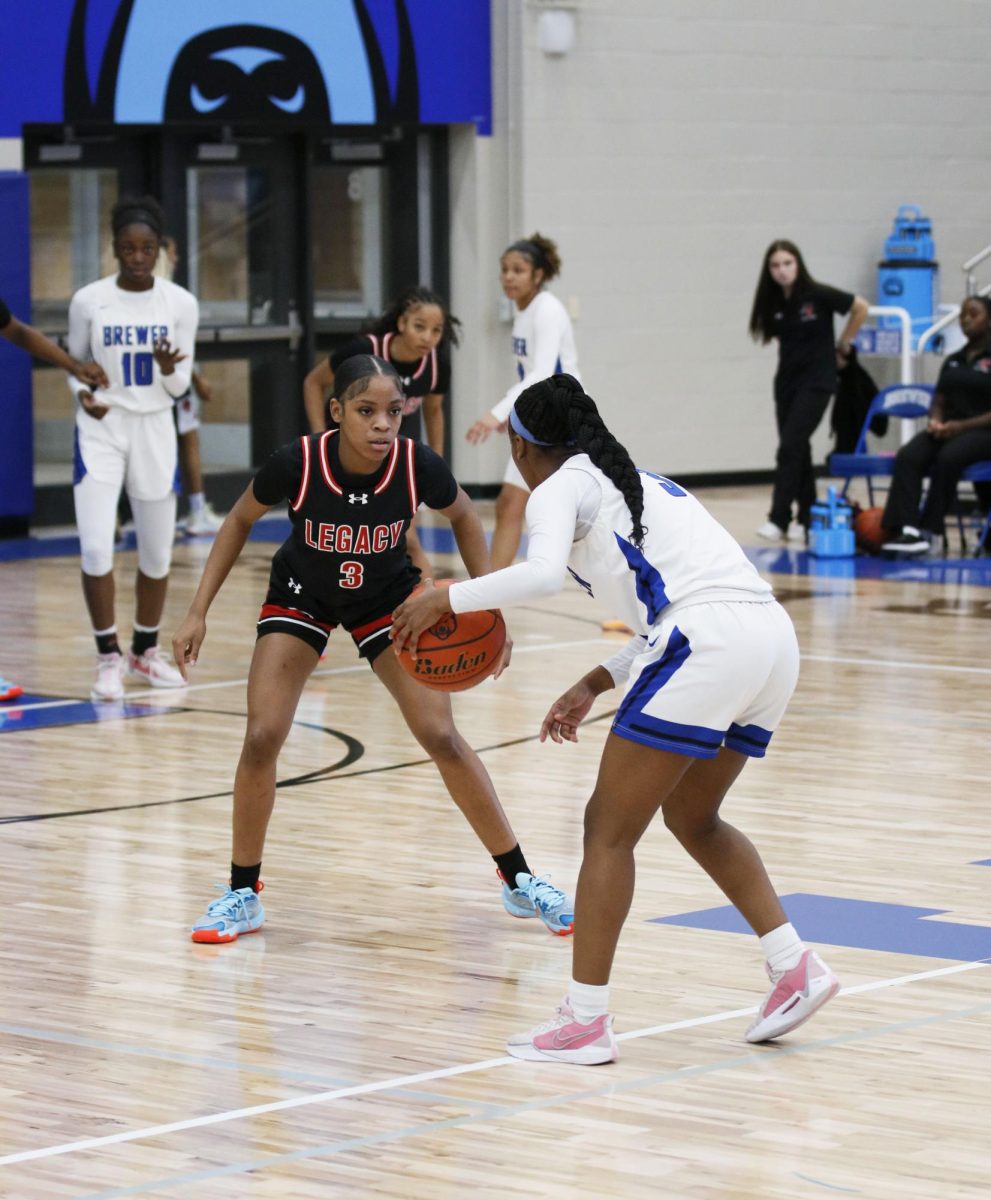 Cy’Nia Jackson, 10, focuses on the opponent she guards while waiting for the right time to get a steal and score for Legacy Broncos.

