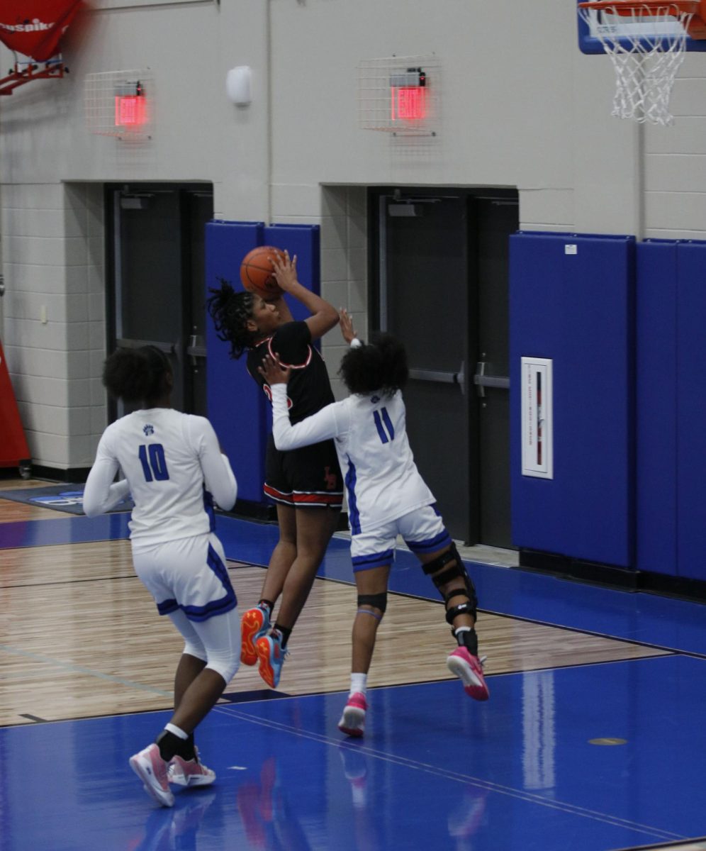 Off a fast break steal Janai DeJesus, 10, goes up for a lay up and makes it turning the score to 18-12.
