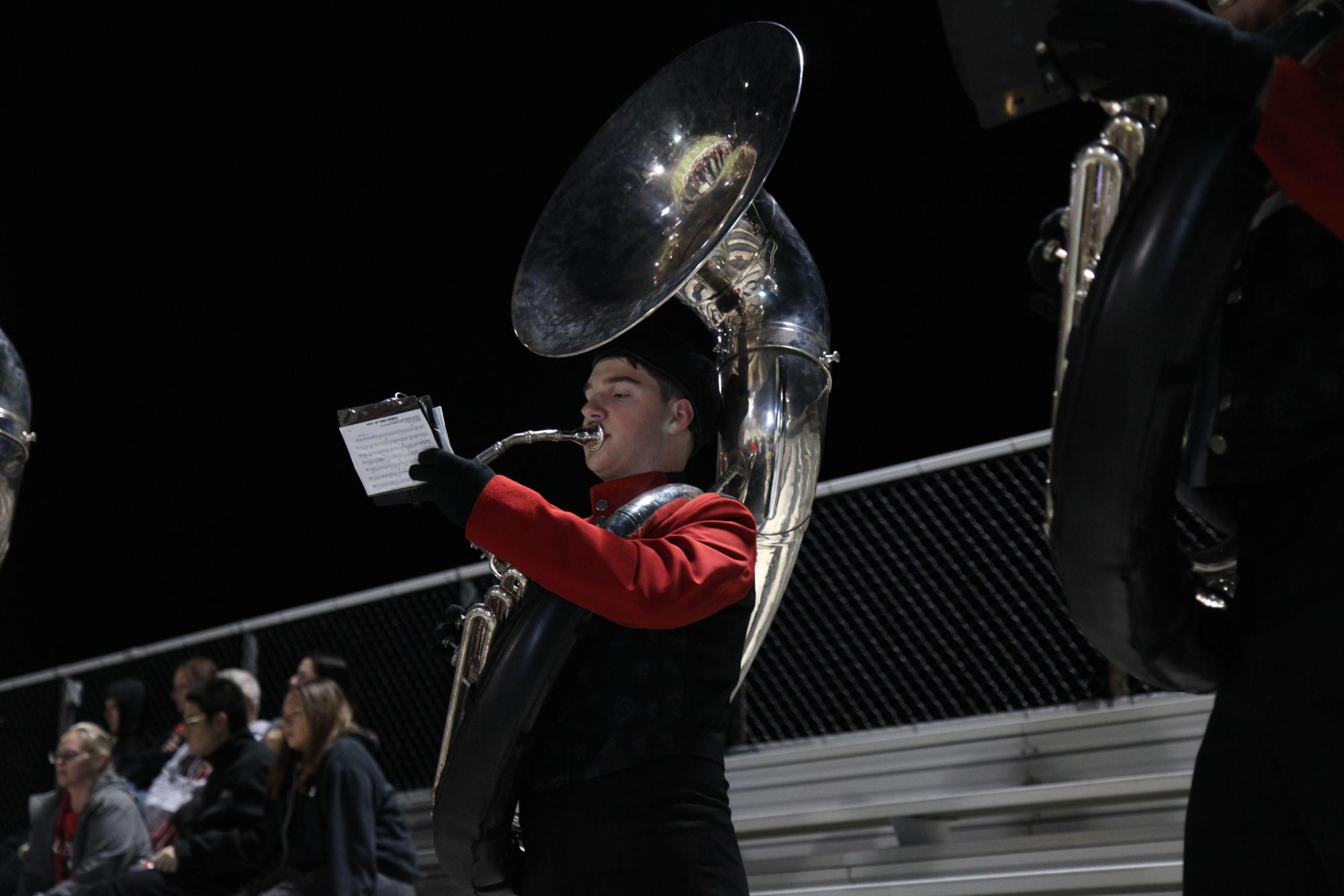 Hunter Tims, 9, plays the sousaphone with marching band at the varsity football game against Southlake Carroll on Nov. 15. 