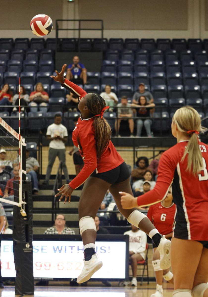 Right after the set, Ayallah Sanogo, 9, spikes the ball over the net to the other team.