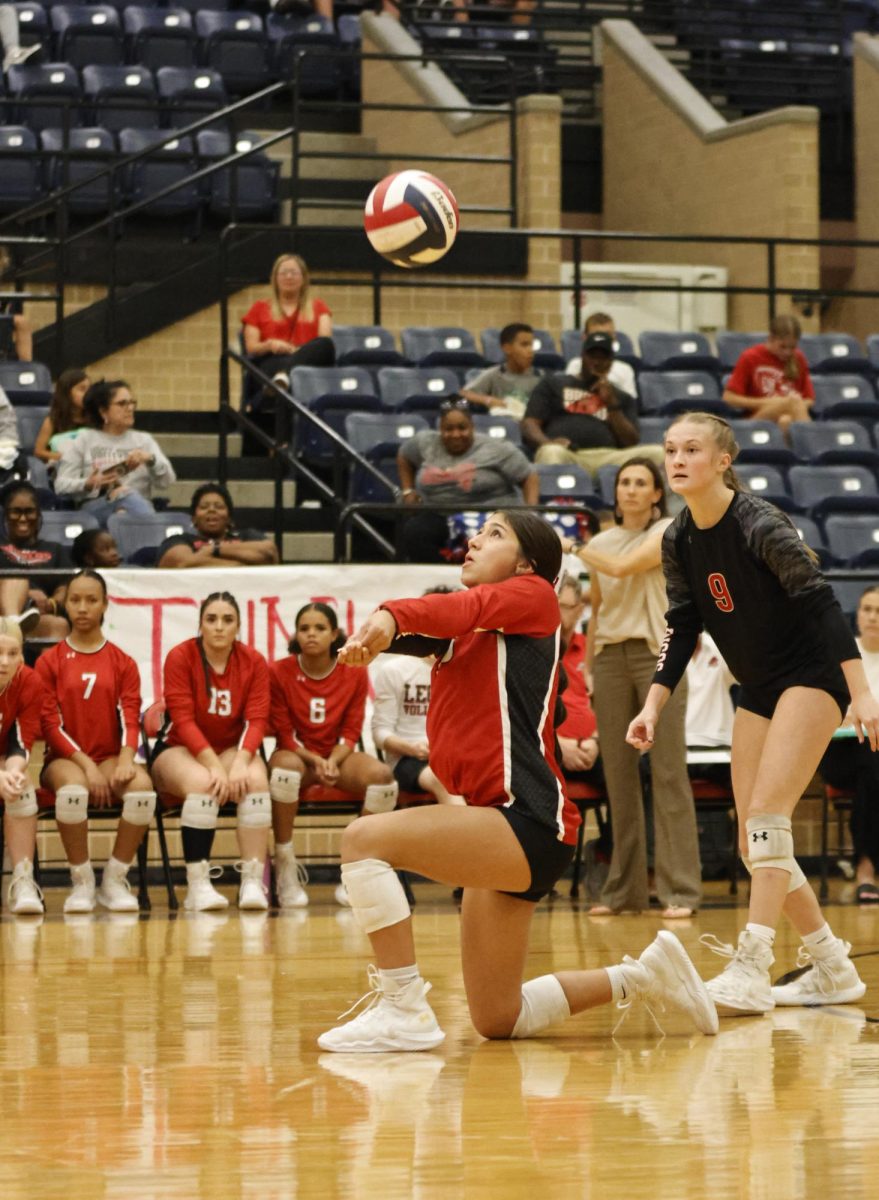 After Boswell served, Arianna Valenzuela, 9, bumps the ball up to her teammates.