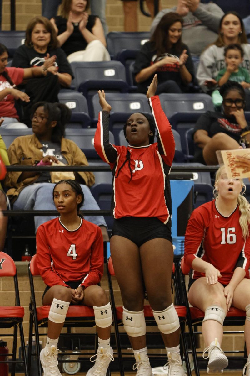 After a play Anjolaoluwa Adeyi, 11, cheers on her team. The team played Boswell with a 2-3 loss.