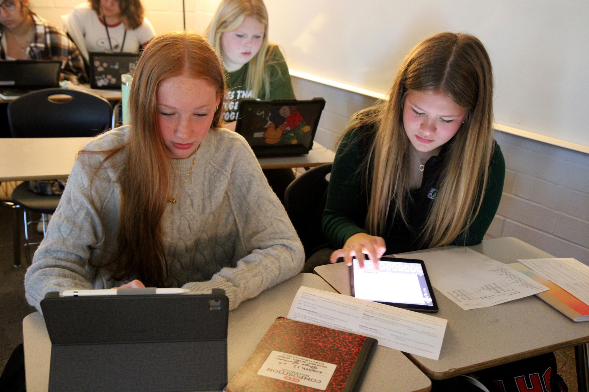 Sophomores Olivia Martin and Jayli Jackson work in English on Nov. 21.