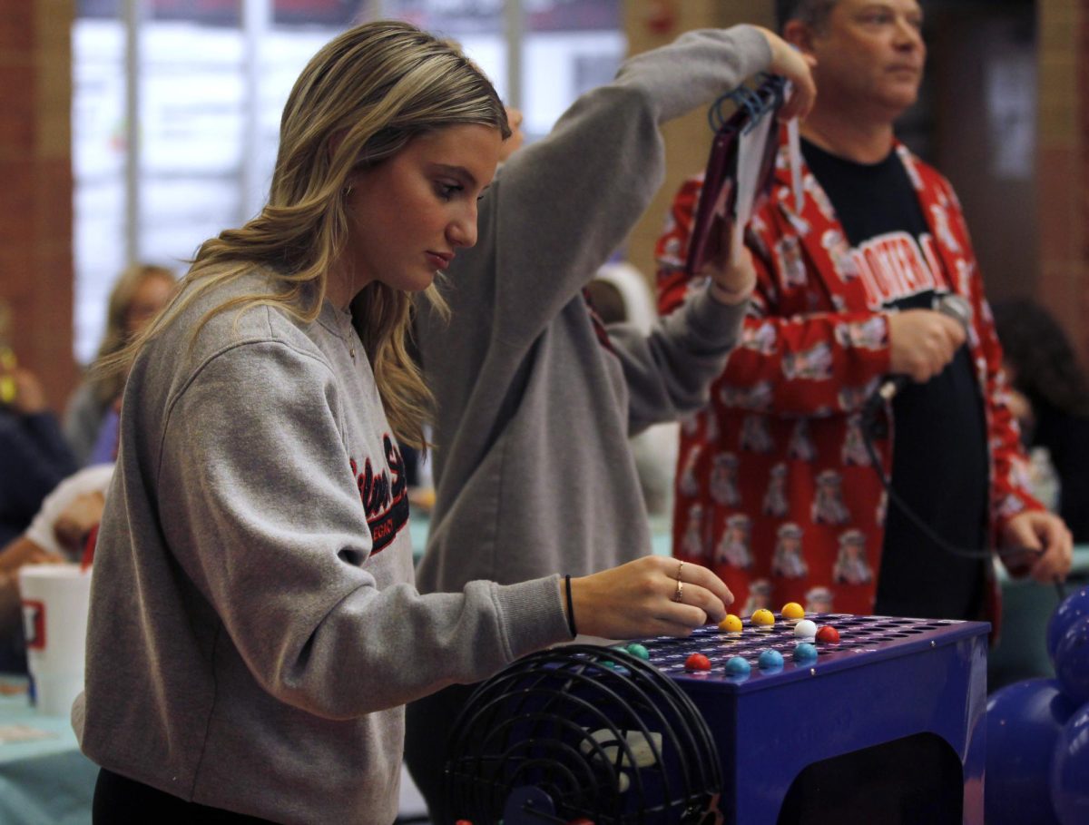 Lexi Longoria, 12, works the Silver Spurs annual Bingo Night.