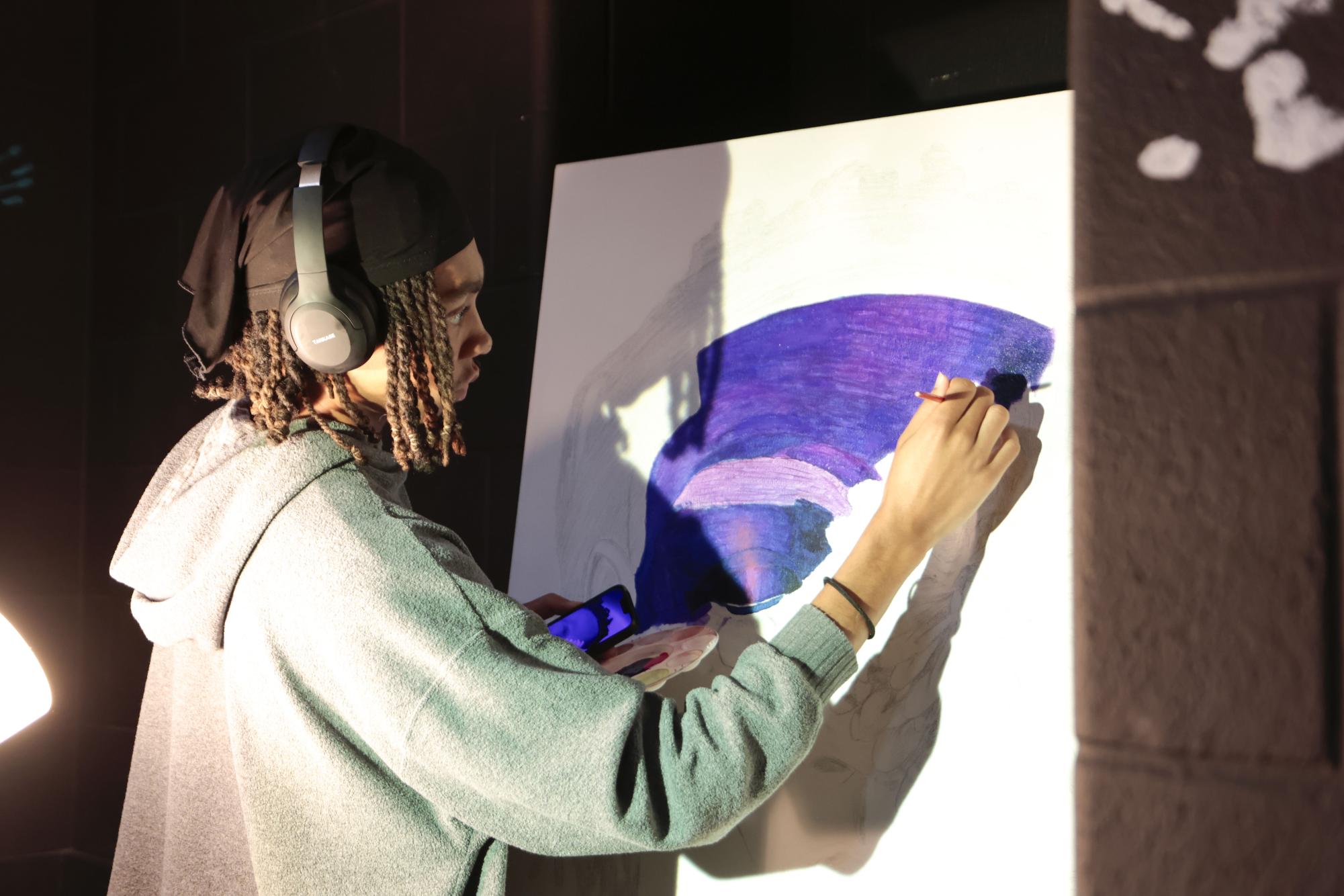 Senior Russell Whitmore works on his project during Art class on April 29.