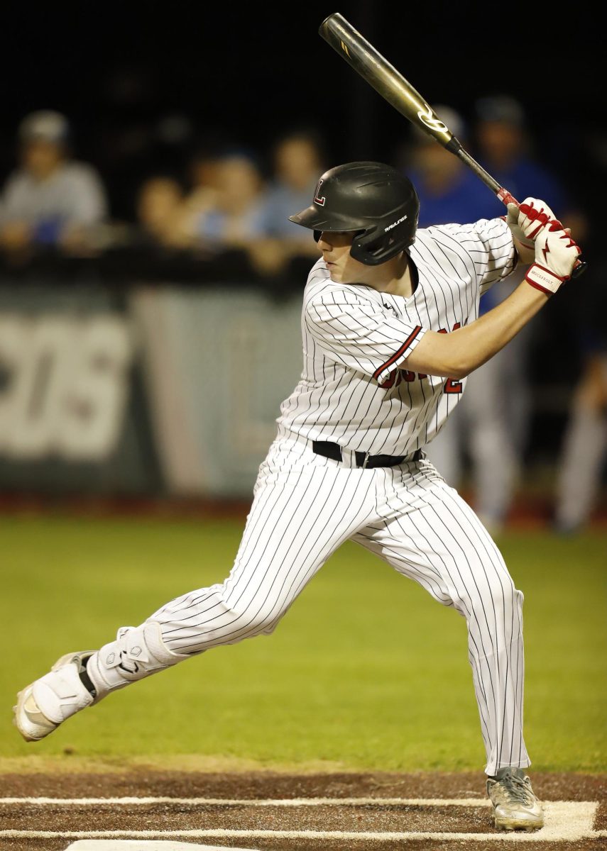Sophomore Jake Jenkins bats at the varsity game against Weatherford on March 18. Legacy won 4-3.