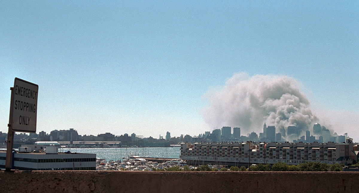 Smoke rises from the site of the World Trade Center Tuesday, Sept. 11, 2001.  
Photo by Paul Morse, Courtesy of the George W. Bush Presidential Library