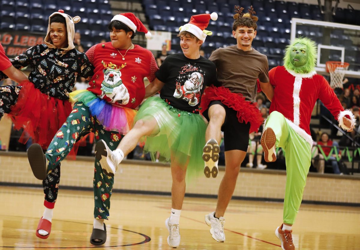 Kick line:
During the halftime show Santa' Little Helpers perform do a kick line. The group danced a routine to "You're A Mean One, Mr. Grich."