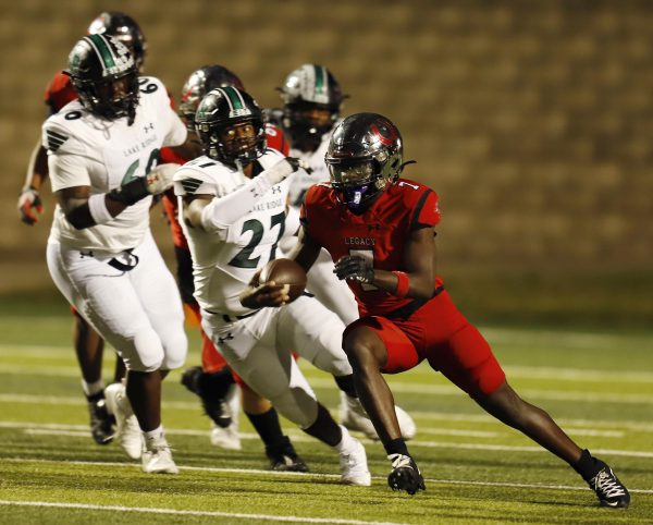 During the game, senior Nathan Wilson runs with the ball passed his opponents. Legacy played Lake Ridge for their last game of the season on Oct. 31. 