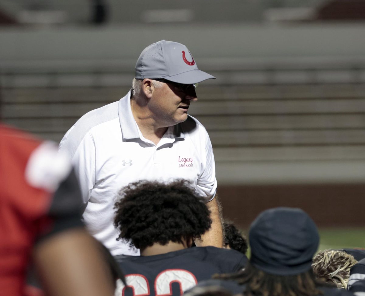 Coach Hulme talks to varsity football after a loss to South Grandprairie. 