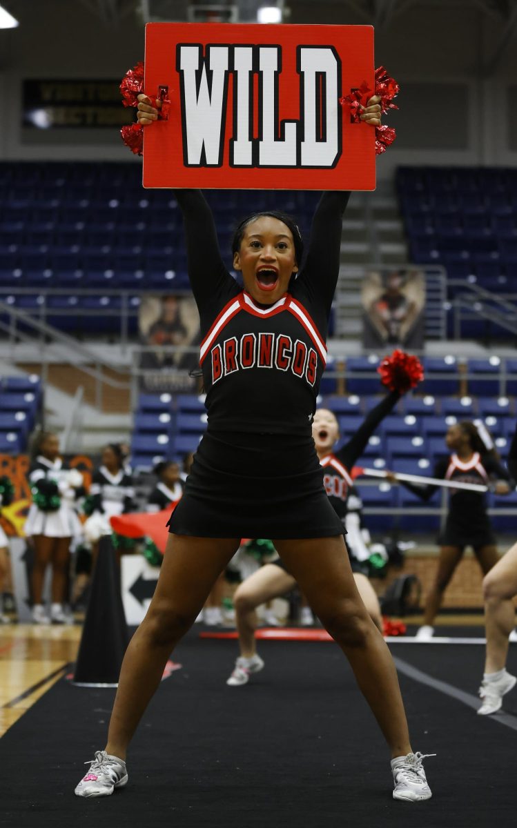 Senior Chloe Calvin cheers at the MISD Showcase on Jan. 13. 