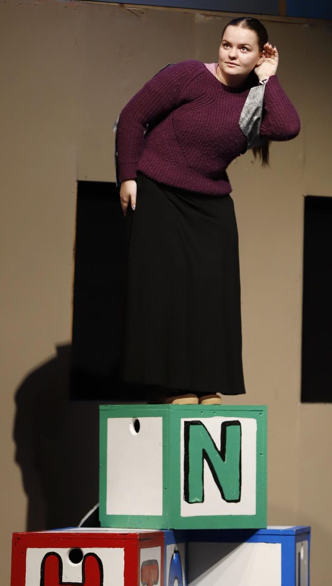 During the Stuart Little performance, Emily Keating, 11, acts as a pigeon eavesdropping on a conversation in the play. Legacy Theatre performs a play for three weeks each November for all Elementary schools in the district. 