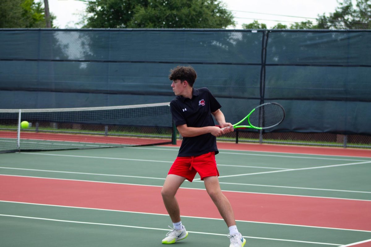 Jude Butler, 12, hits a backhand toward his opponent. Butler played mixed doubles with Kendal Axe, 12, on Sept. 2.