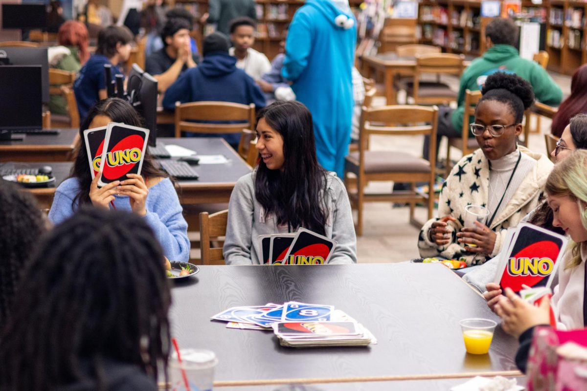 At AP Senior Breakfast, students play a game of Giant Uno. Phone bans as a part of H.B. 1481 encourage students to interact more.