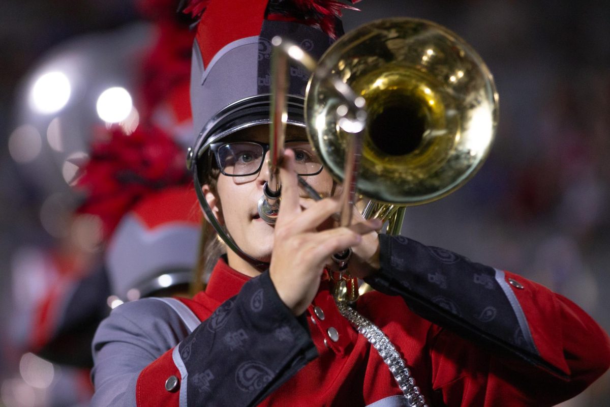 Halftime:
At the Pink Out game against Bowsell, Jaxen Kolanek, 12,  plays his trombone during the halftime show Oct. 9.