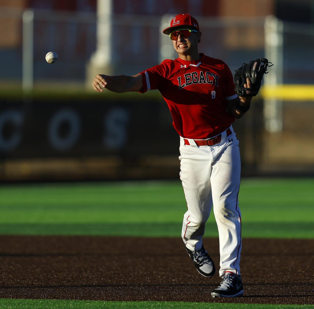 During the scrimmage on Feb. 16, Grant Petersen, 11, throws the ball from shortstop to first base.