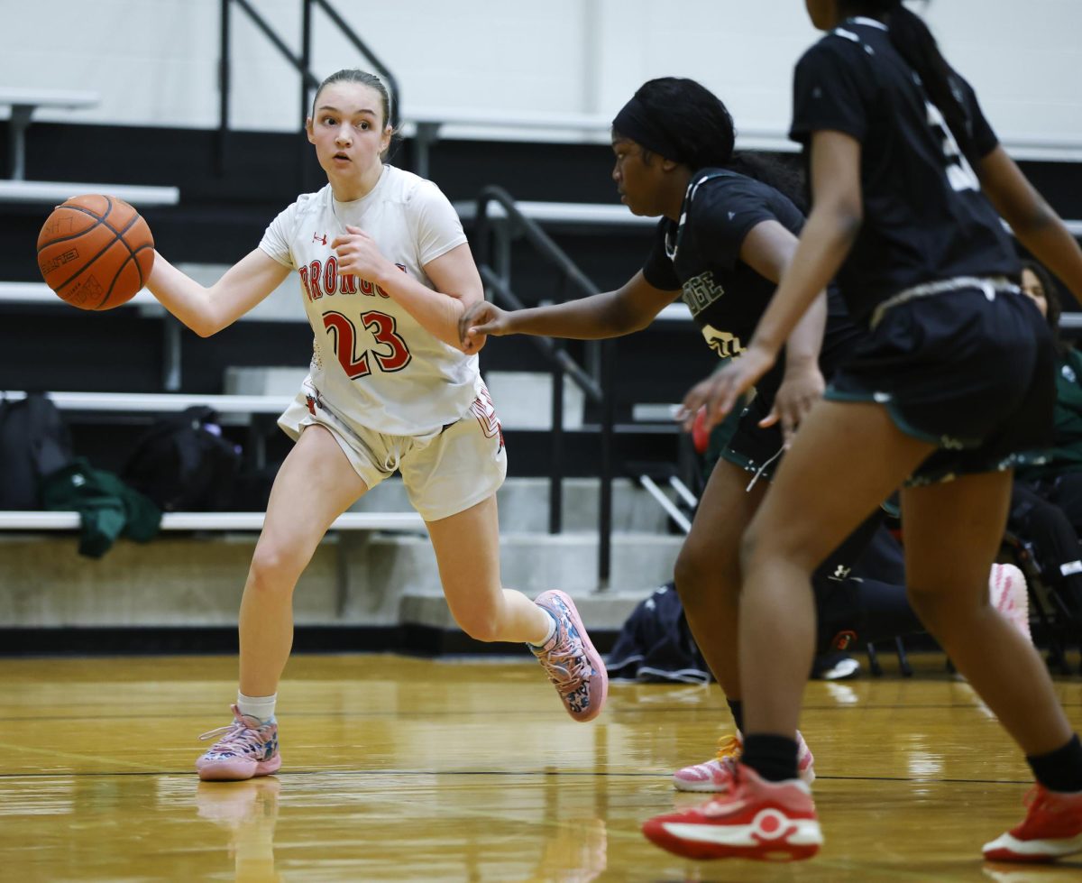 During the game against Lake Ridge, Lilia Hladik, 9, looks to pass the ball to her teammate.