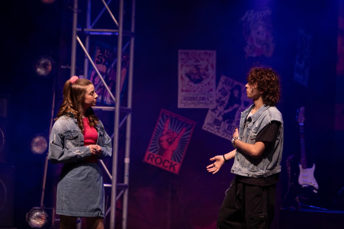During Theatre's production of Rock of Ages, Olivia Butler, 10, and Cayden Newkirk, 12, act out the characters Sherry and Drew meeting for the first time. 
