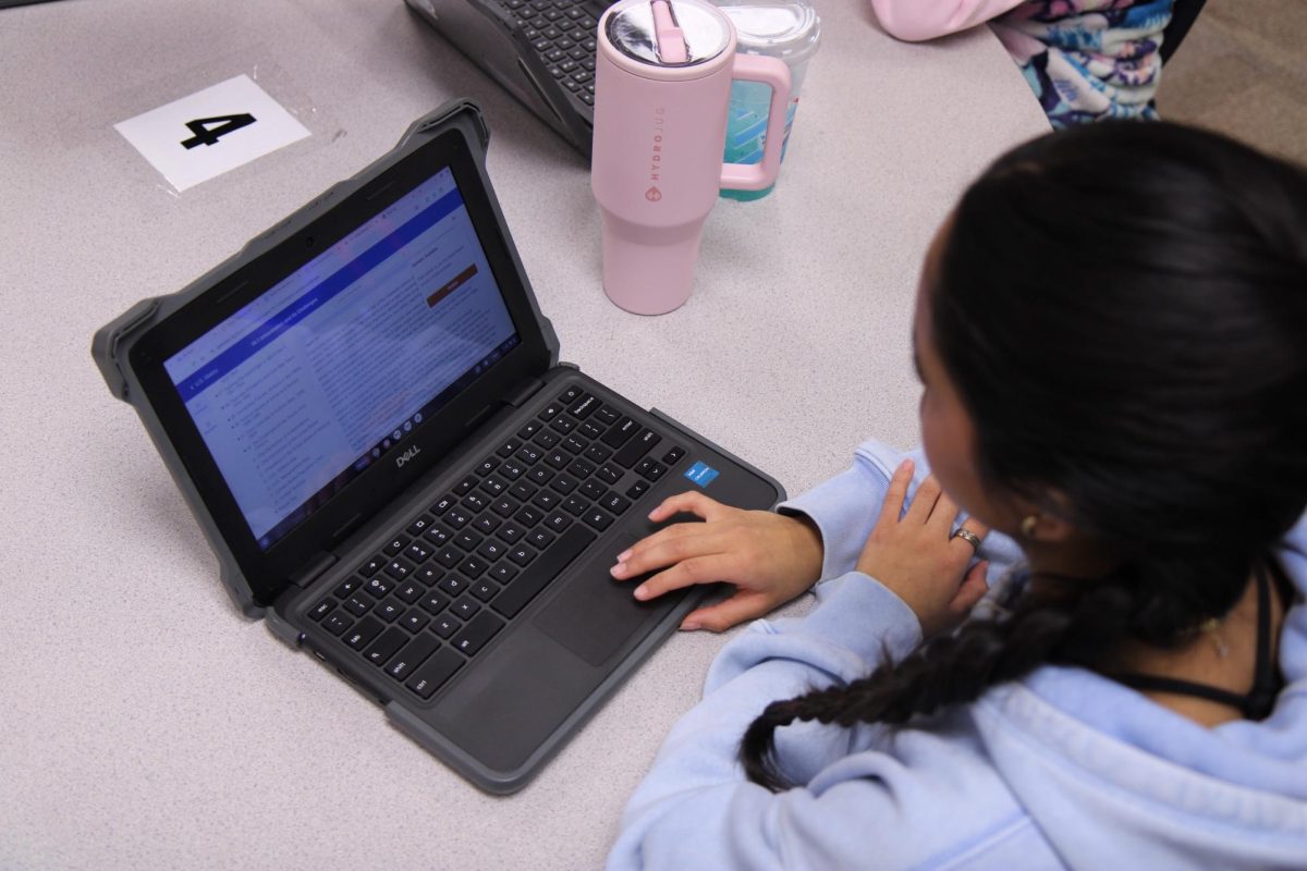 During a virtual TCC United States history class junior Autumn Capetillo reads the textbook. 
