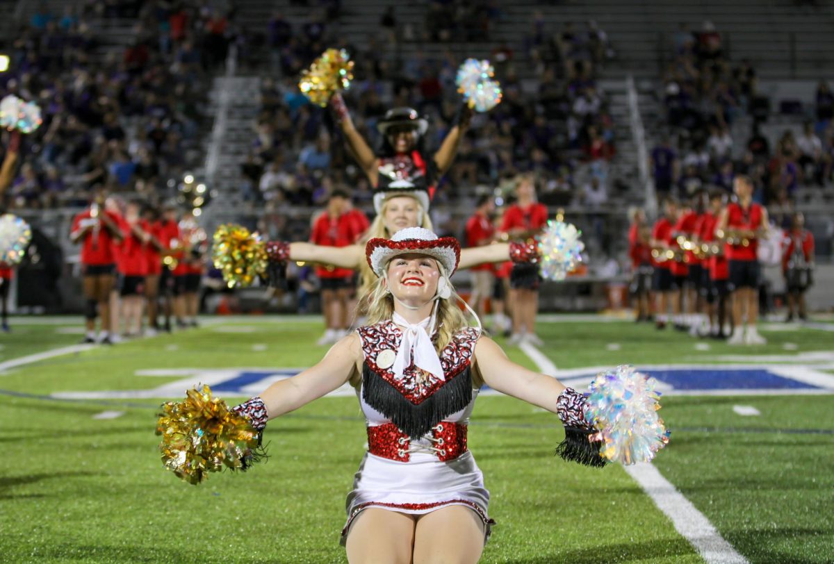 Trifecta: 
During halftime, Silver Spurs 1st Lt. Emma Beaudine, 12, leads her line in the dance. Legacy beat Chisholm Trail, 33-24, on Sept. 5.