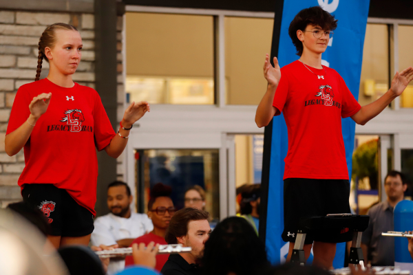 During the Sams reopening, Piper Lipscomb, 11, and Reed Pickering, 12, conduct the band. Band performed in front of Sam's Club on Oct. 3.