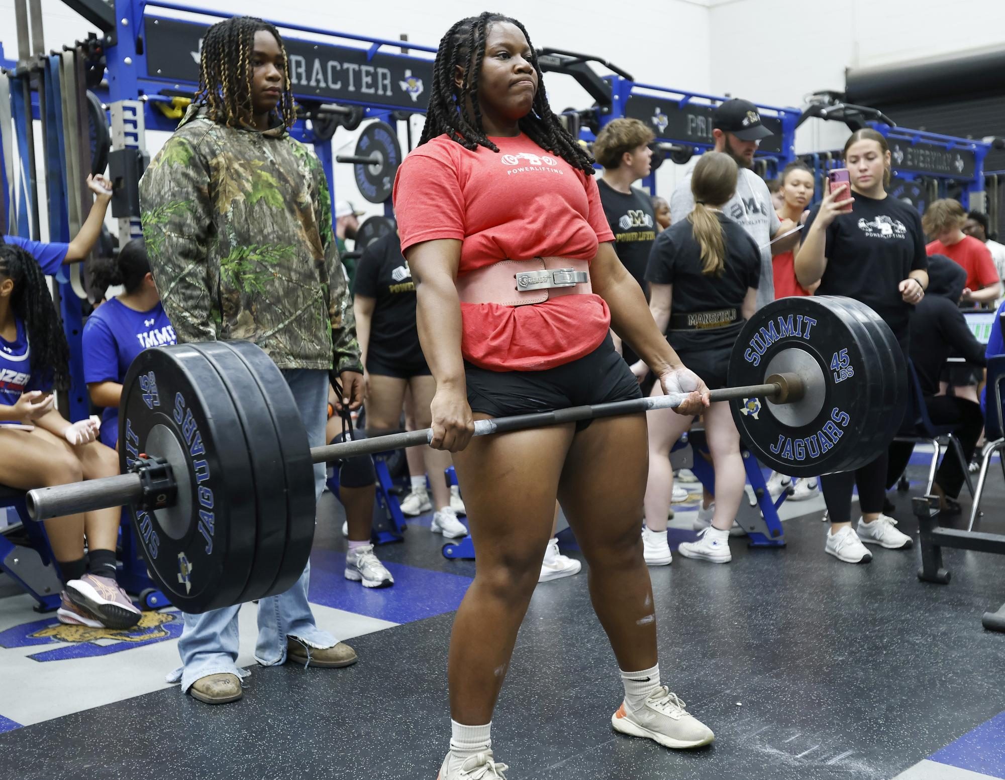 Mackenzie Voss, 11, lifts at the first powerlifting meet on Jan. 14. Voss is advancing to state among two others. 