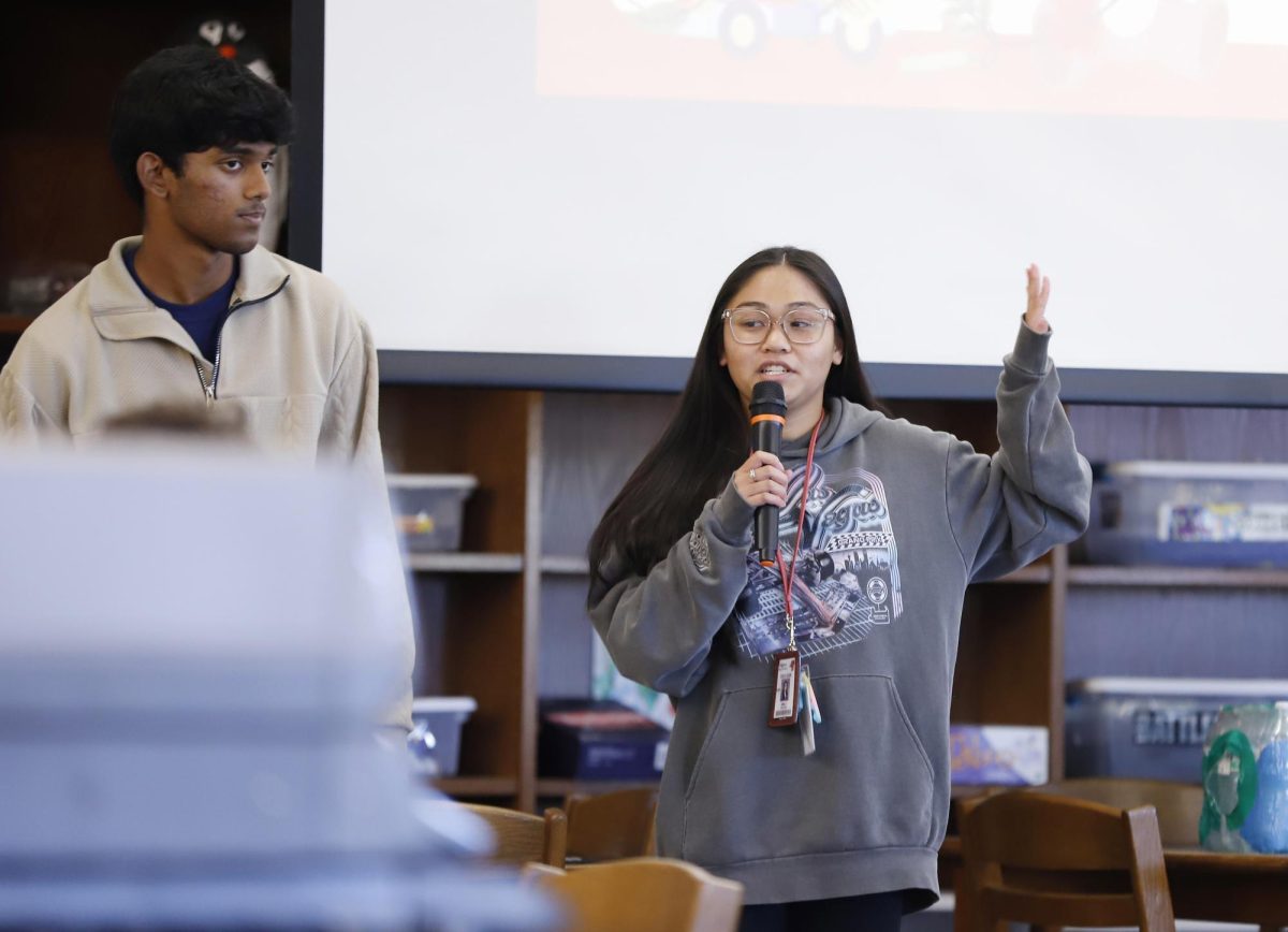 NHS Vice President Emily Nguyen, 12, and President Anay Bhakta, 12, speak at an NHS meeting on Nov. 10, 2025.