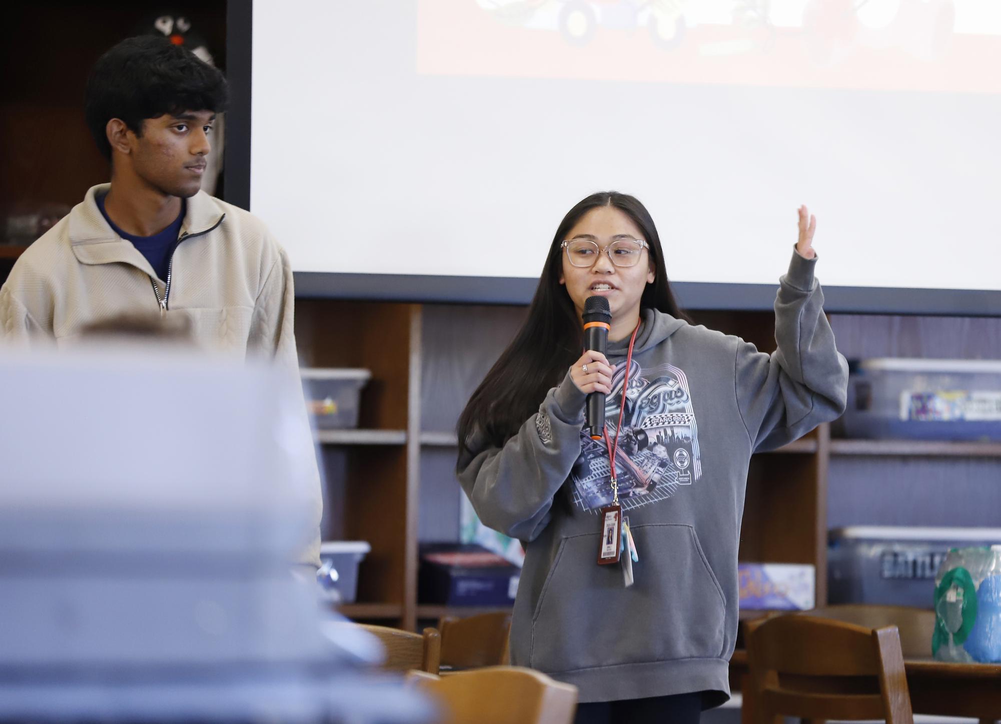 NHS Vice President Emily Nguyen, 12, and President Anay Bhakta, 12, speak at an NHS meeting on Nov. 10, 2025.