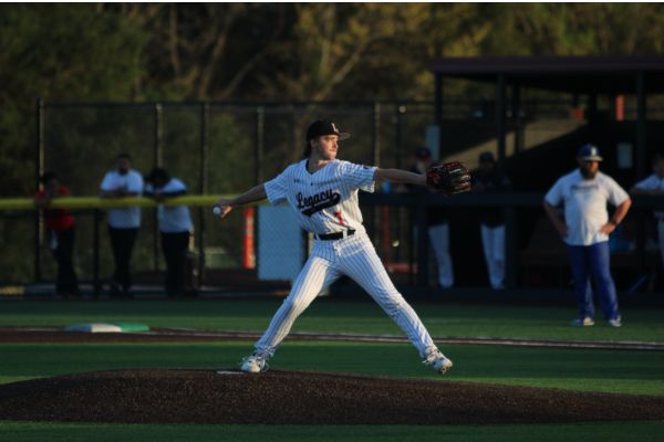 During a game, Corbin McDaniel, 11, extends while pitching the ball. 