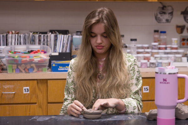 Anneliese Robertson, 12, molds a clay pot. As part of her art education she participates in both AP 3D art and Ceramics, allowing her more time to fine-tune her skills. 