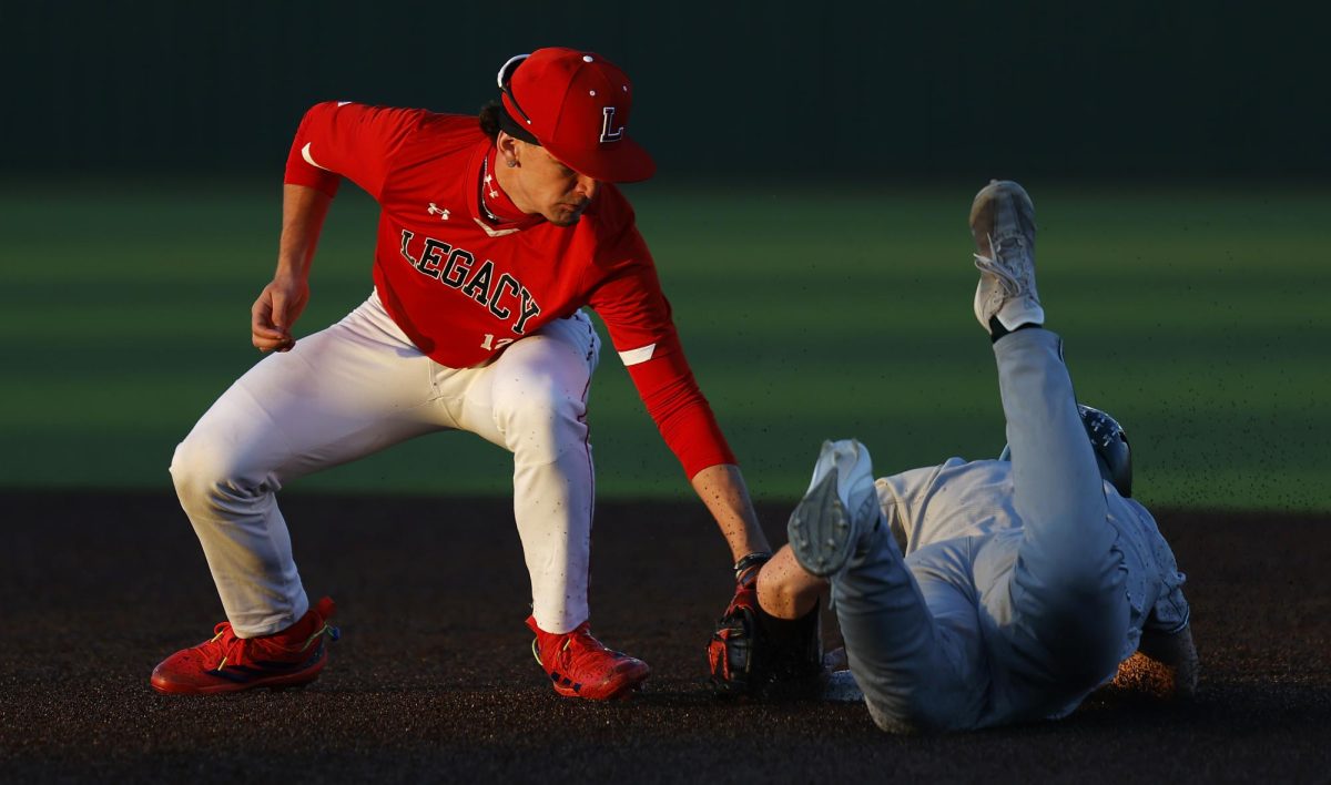 On the pitch:
As the runner steals second Feb. 16, short stop Lawson Hicks, 12, lays a tag during the varsity scrimmage against Waxahachie. Legacy tied Waxahachie, 9-9. Hicks had two home runs in the game and Jake Jenkins, 11, had one.