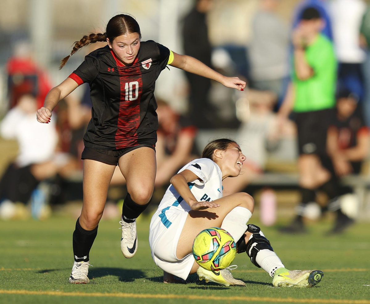 Attack:
Sophia Maldonado, 12, drives past a Panther Creek defender Jan. 2 during the varsity tournament at the Toyota Soccer Center in Frisco. Legacy defeated Panther Creek 8-0 in their pre-season game.