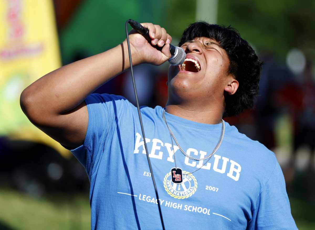 All love:
At Westside Picnic on April 24, Pedro Aguilando, 10, sings "Love" by Keyshia Cole to win a prize at the Legacy choir booth.