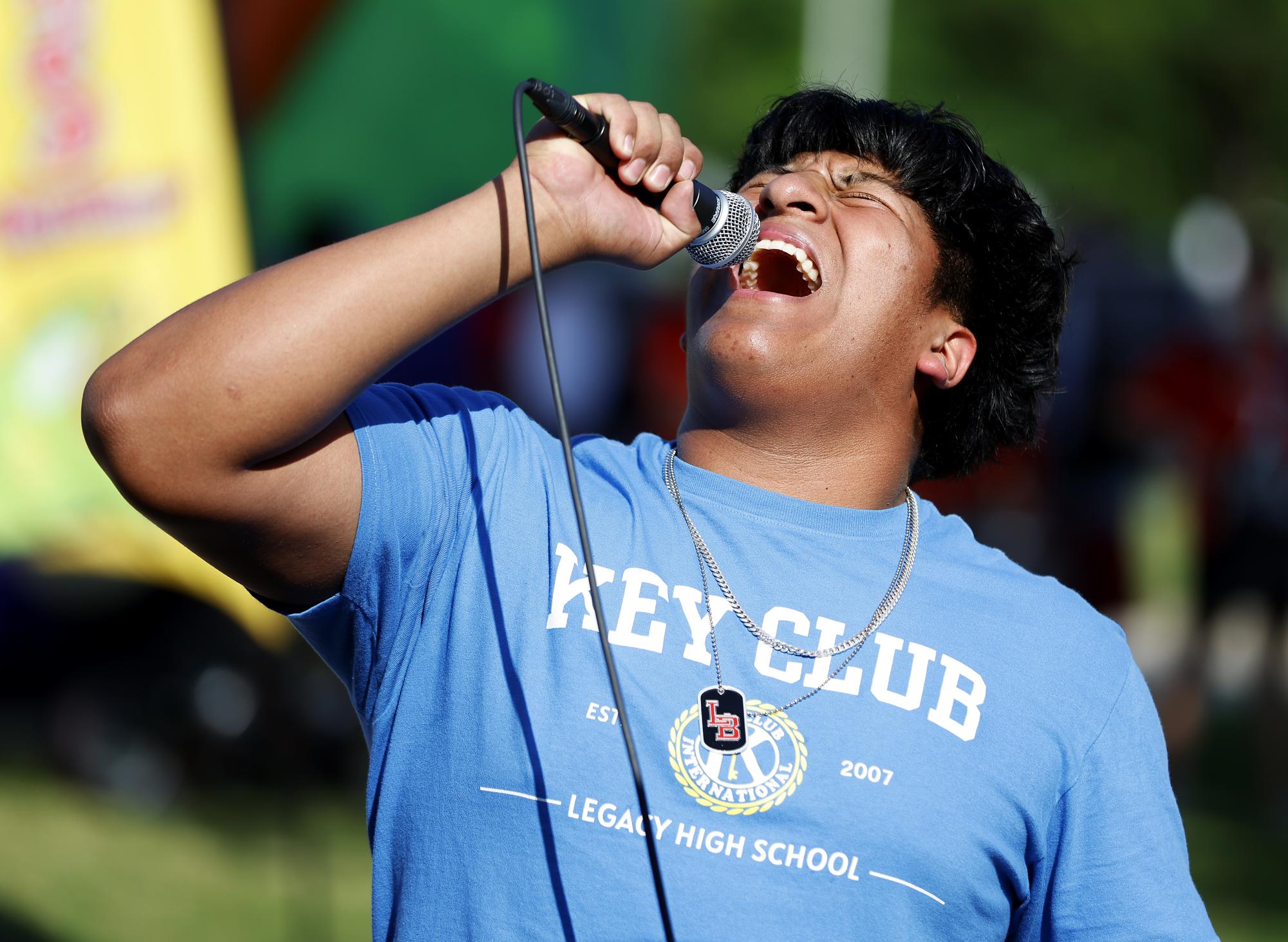 All love:
At Westside Picnic on April 24, Pedro Aguilando, 10, sings "Love" by Keyshia Cole to win a prize at the Legacy choir booth.