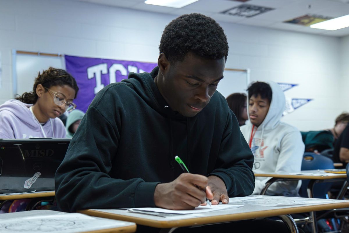 During Ms. Smith's Pre Calculus class, Courtney Richardson, 12, works through the class worksheet. 
